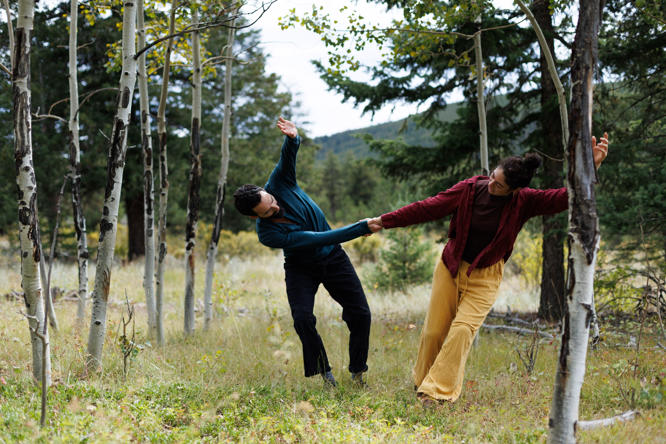 Two dancers sharing weight in contact improvisation